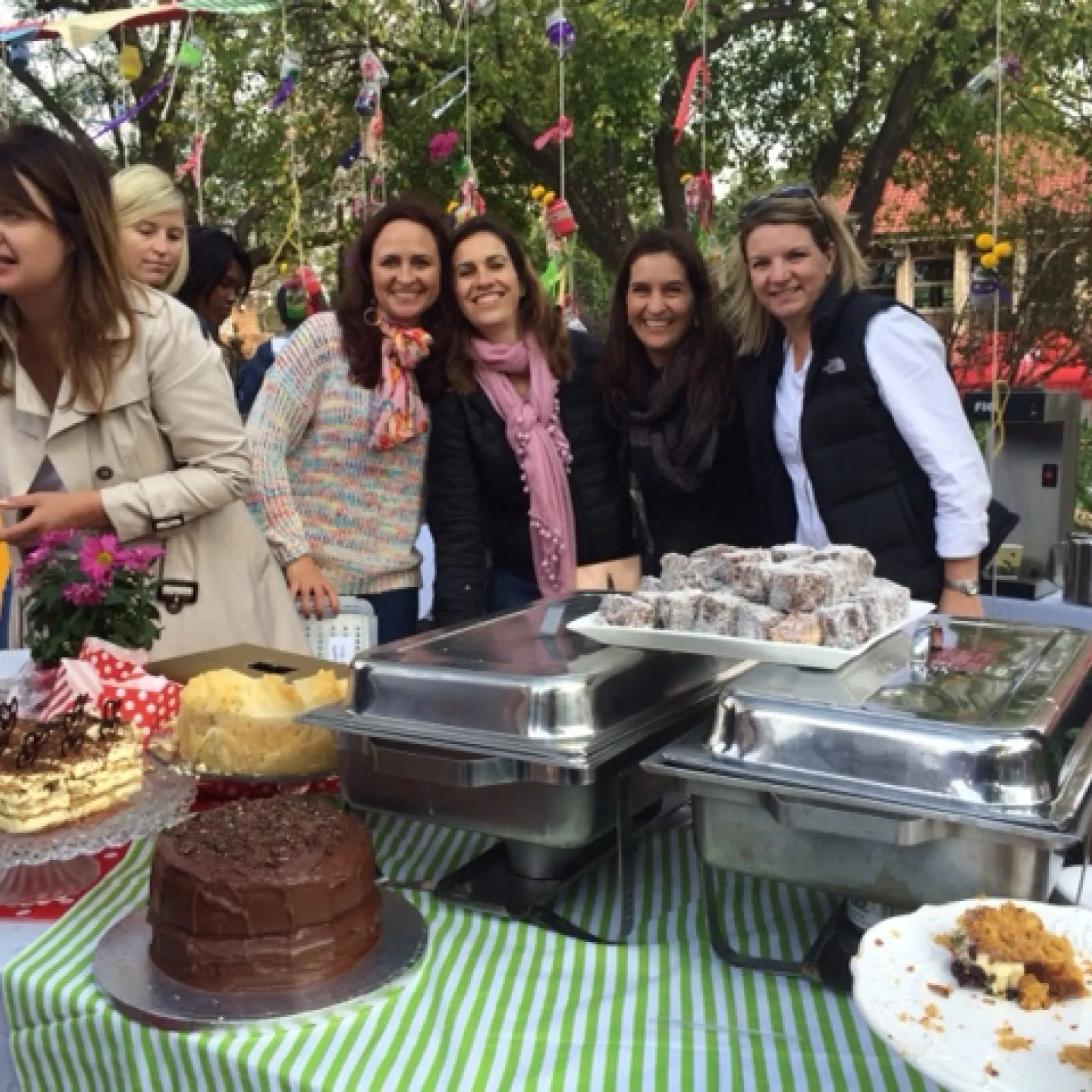 Moms serving at the tea garden at the pta fun day