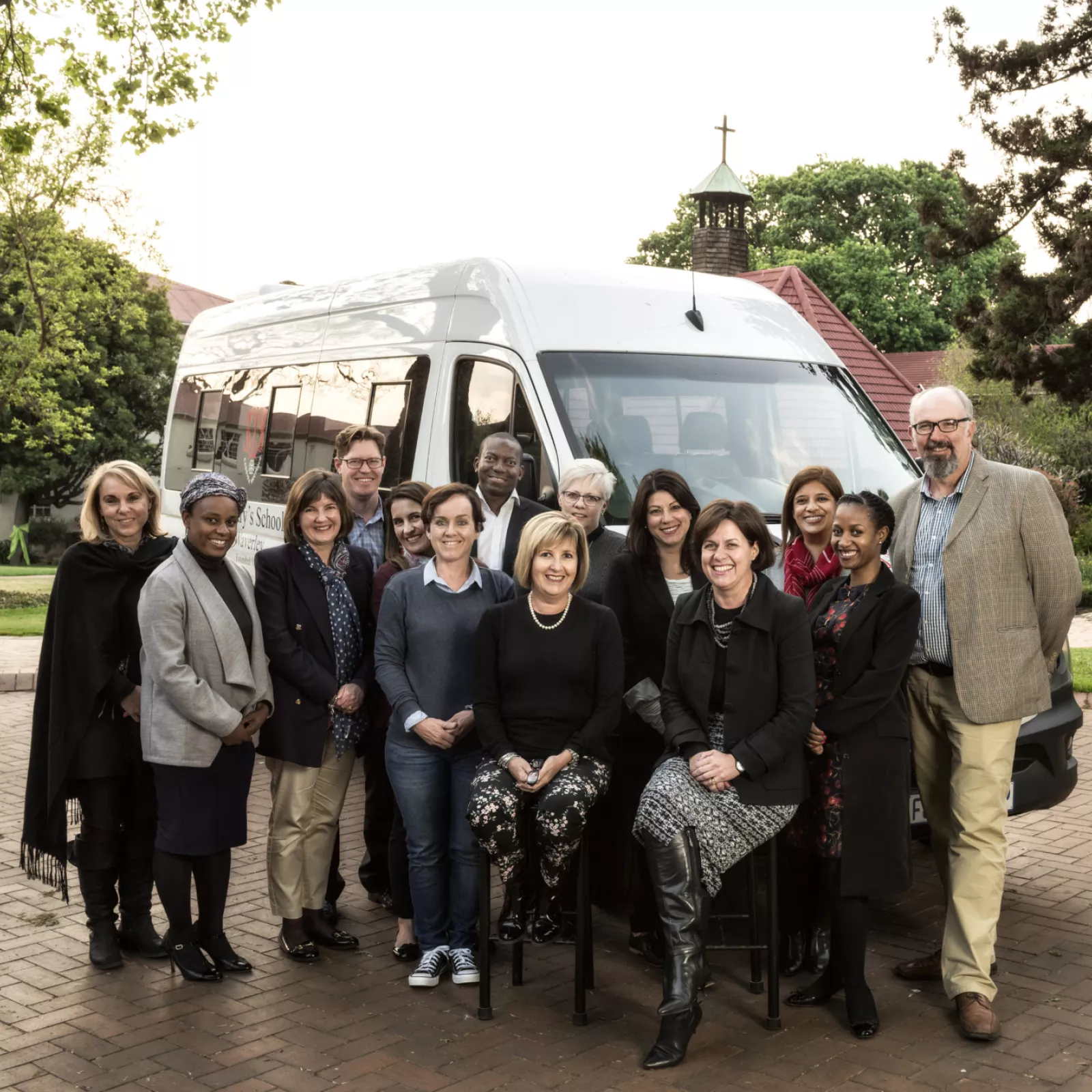 The pta committee with one of the new 22 seater busses