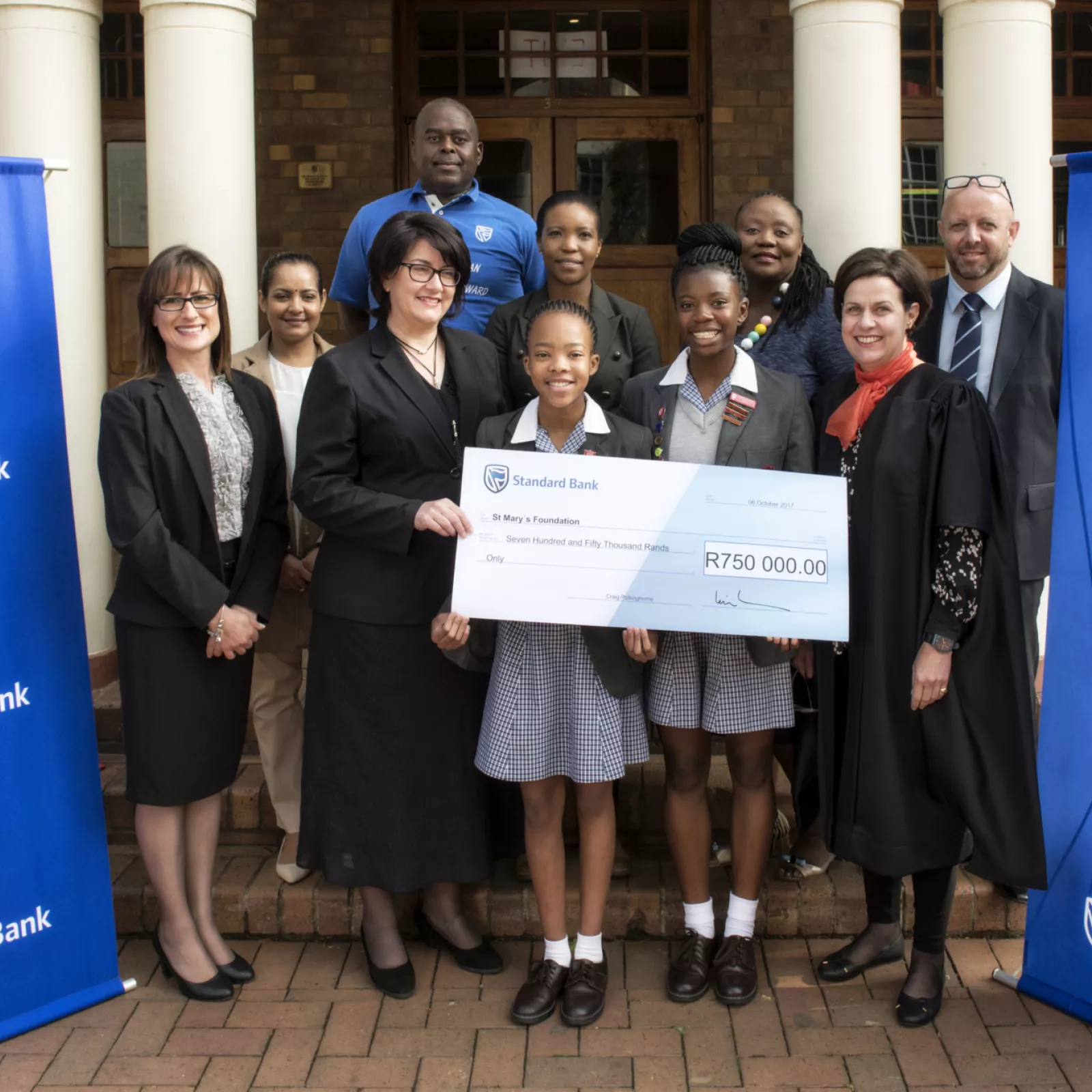 Standard bank commercial banking division presneting a cheque to the st marys foundation