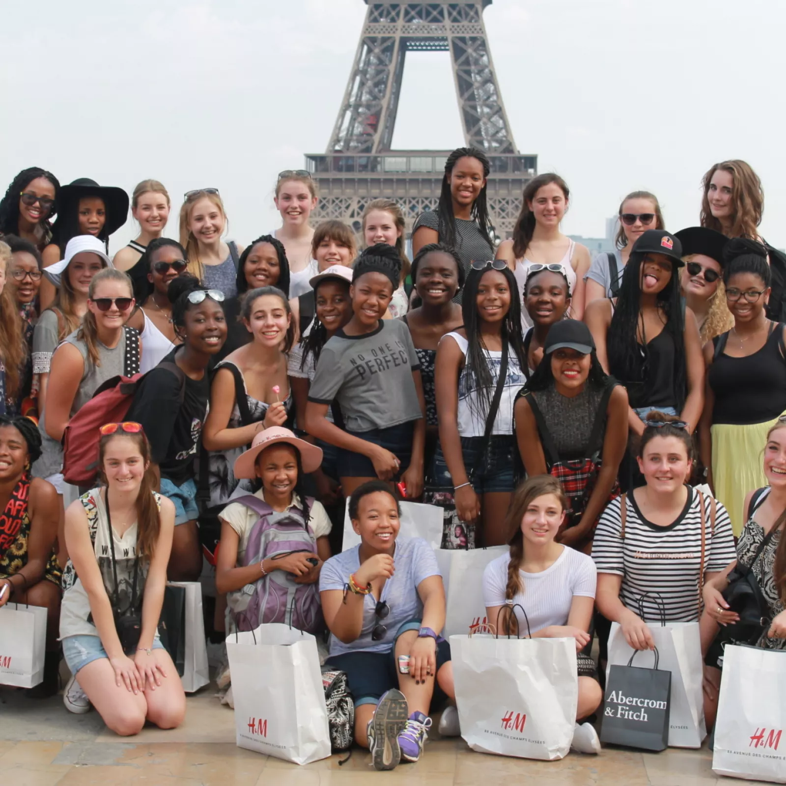 Relaxing after a busy days shopping in front of the eiffel tower