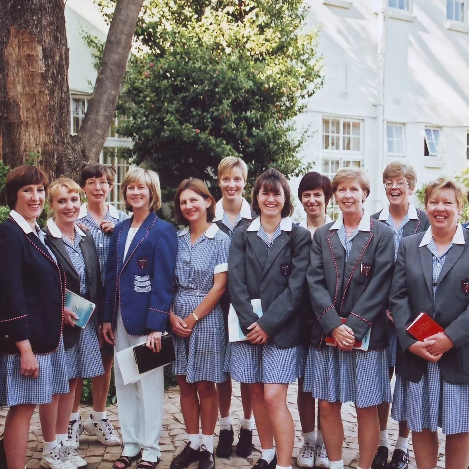 Staff on Ycivvies Y day the headmistress Y office soon to relocate behind them