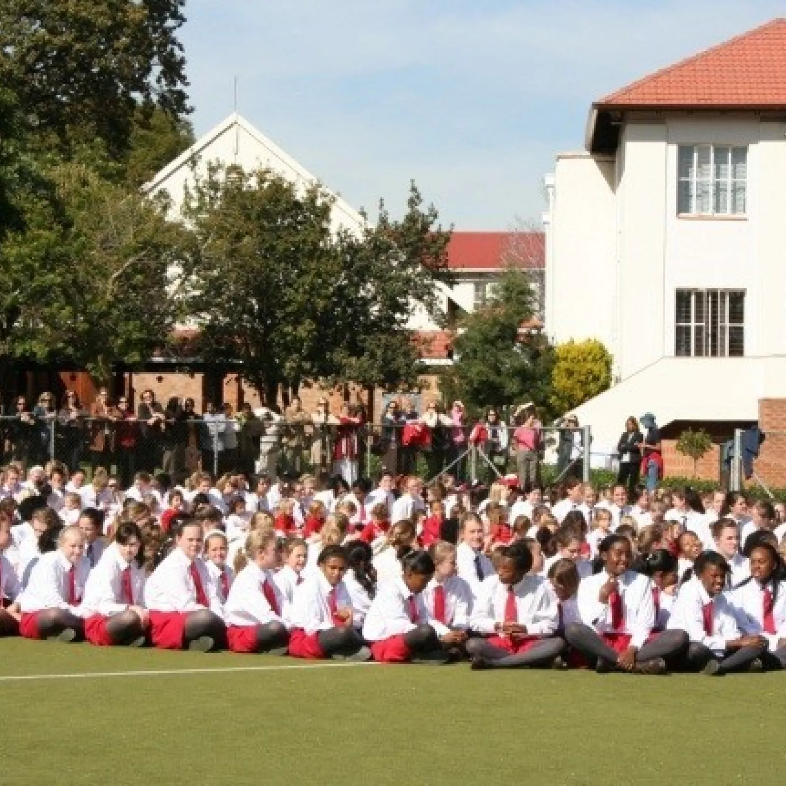 Girls on the astroturf with the science block behind them some years later