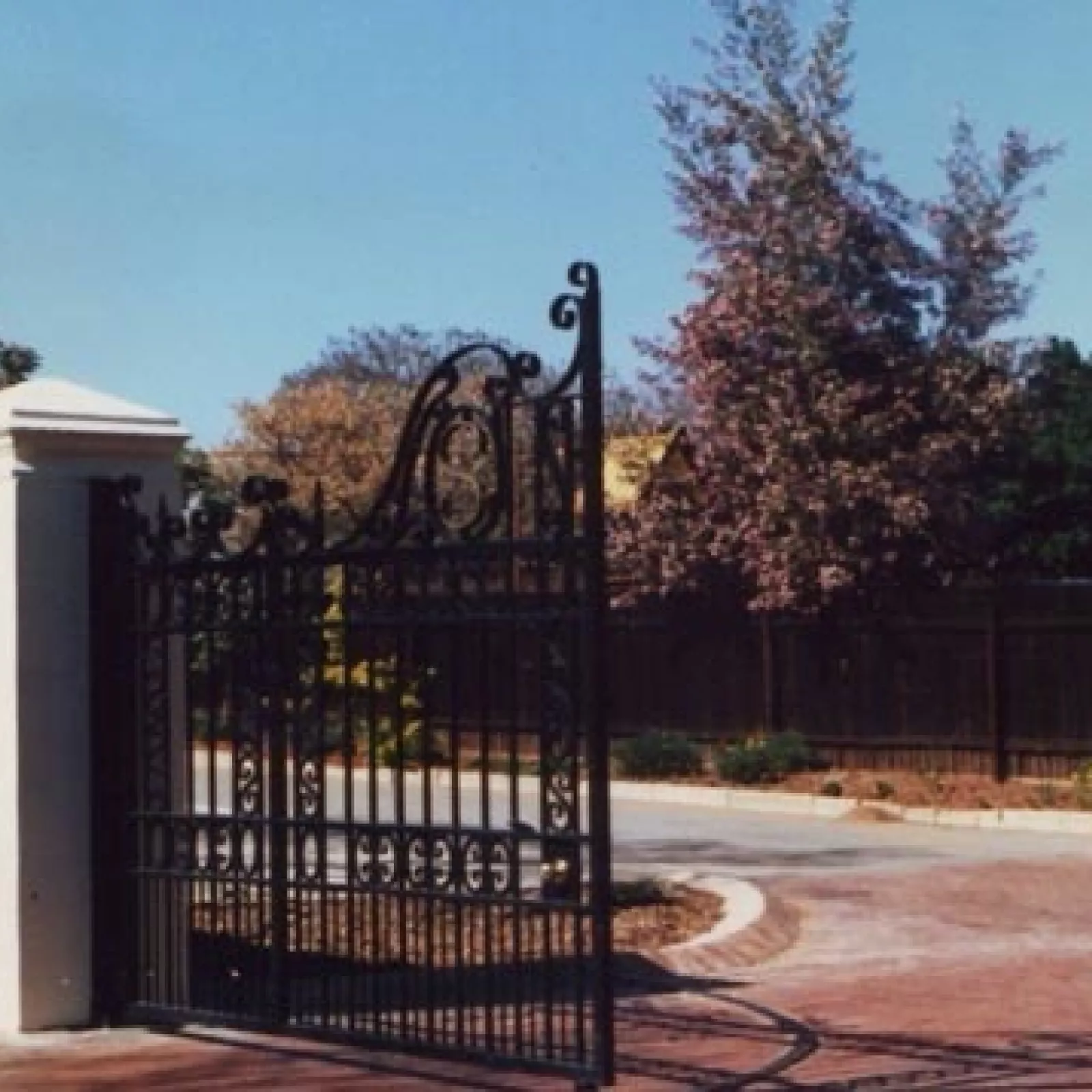 The wrought iron gates the centenary gift in memory of miss darke given by the pta