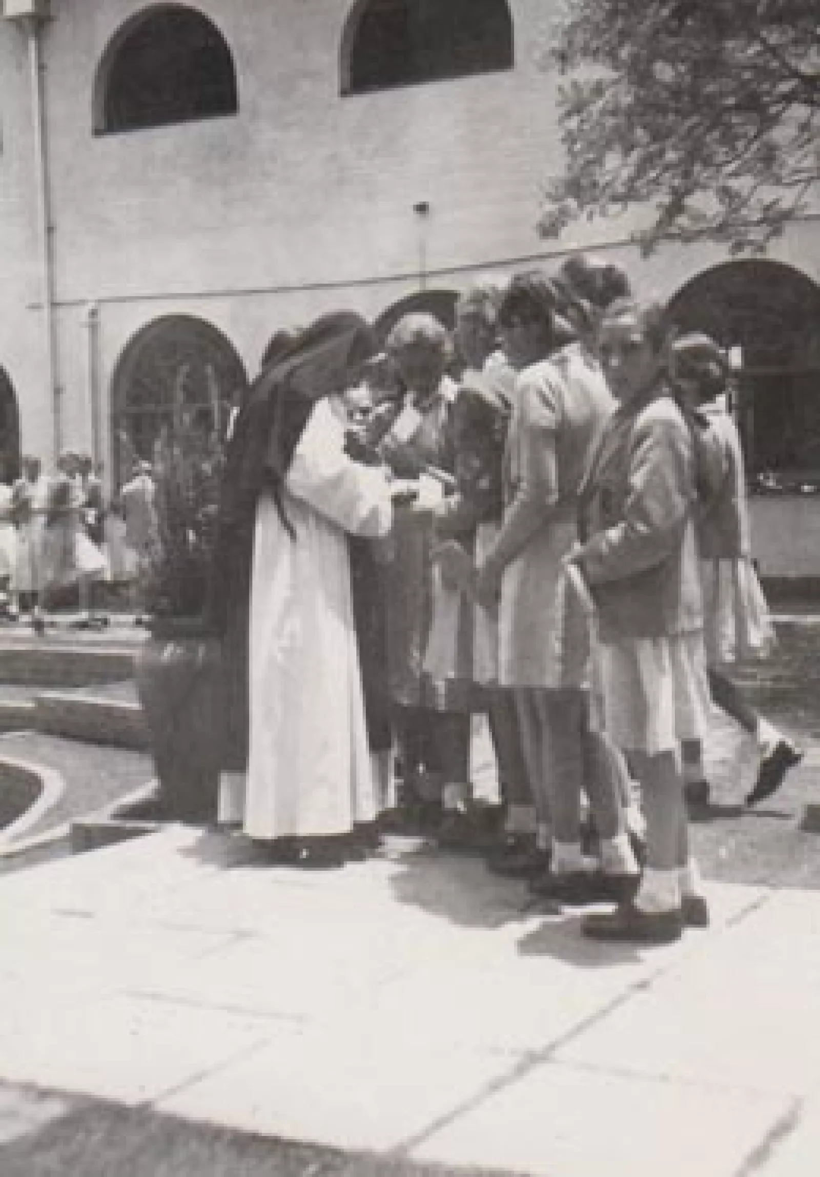 A sister inspects school uniform at the top of queen Ys path