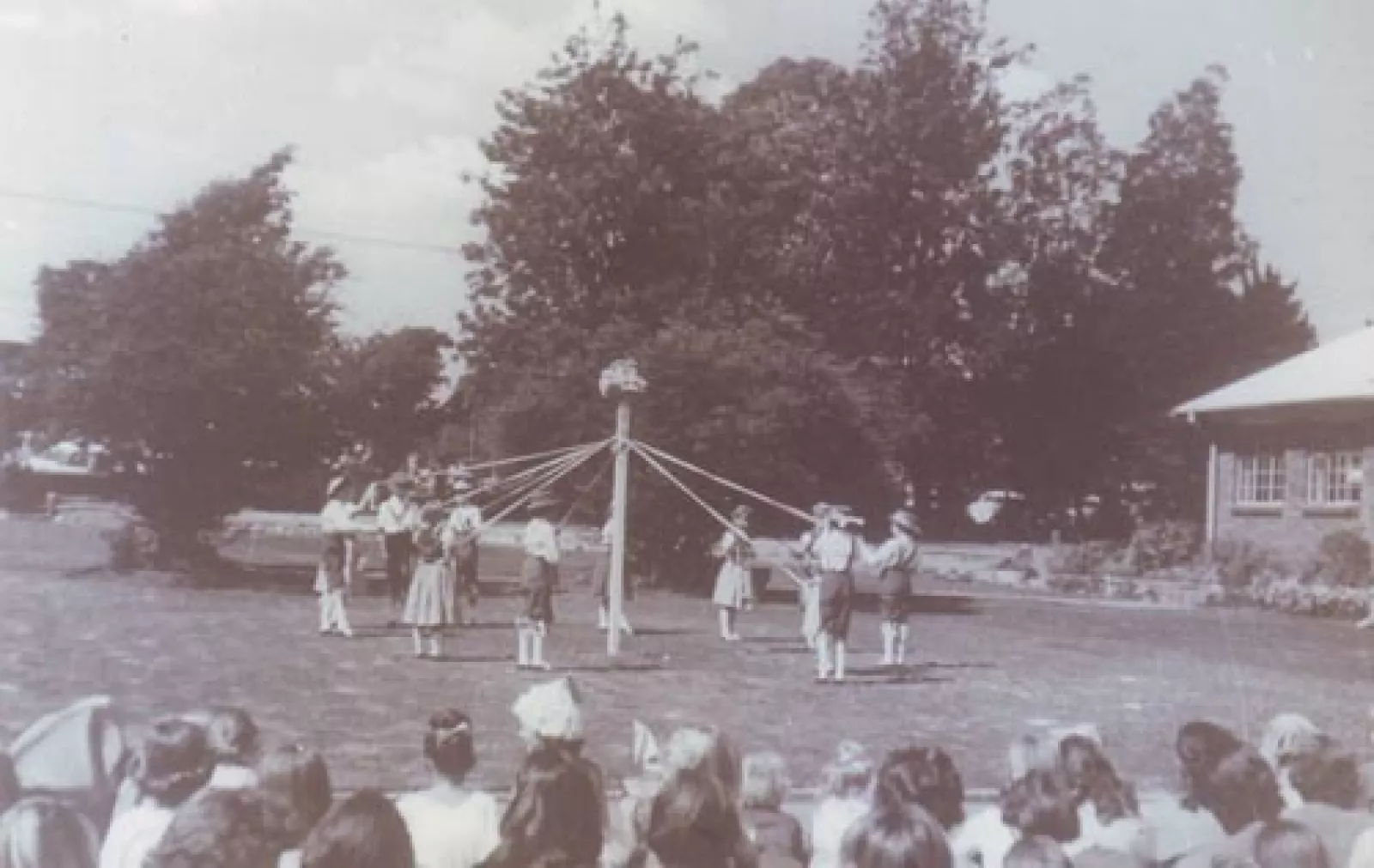 Girls in the junior school learn maypole dancing