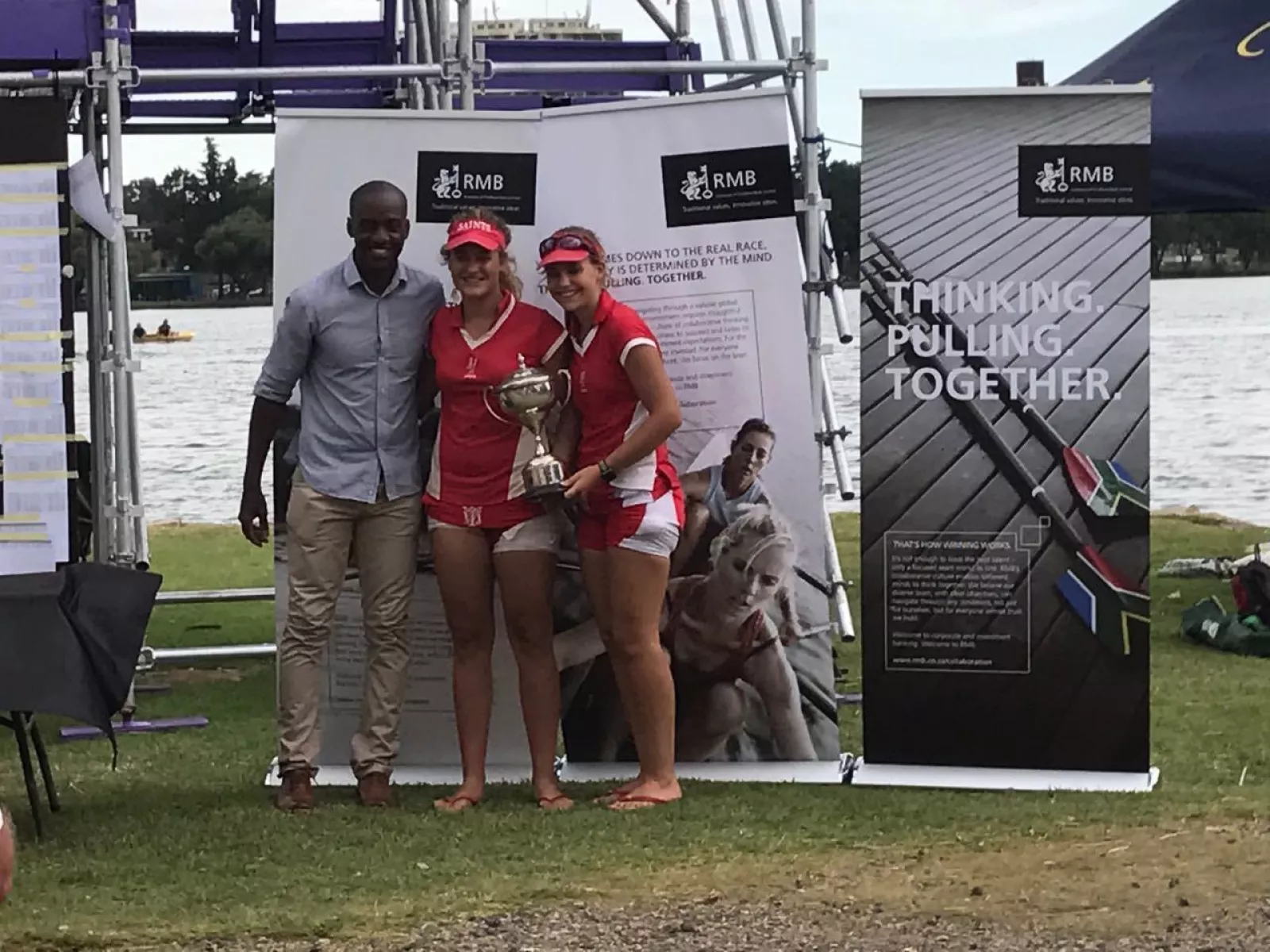 Vice captains accepting the trophy with olympian sizwe ndlovu